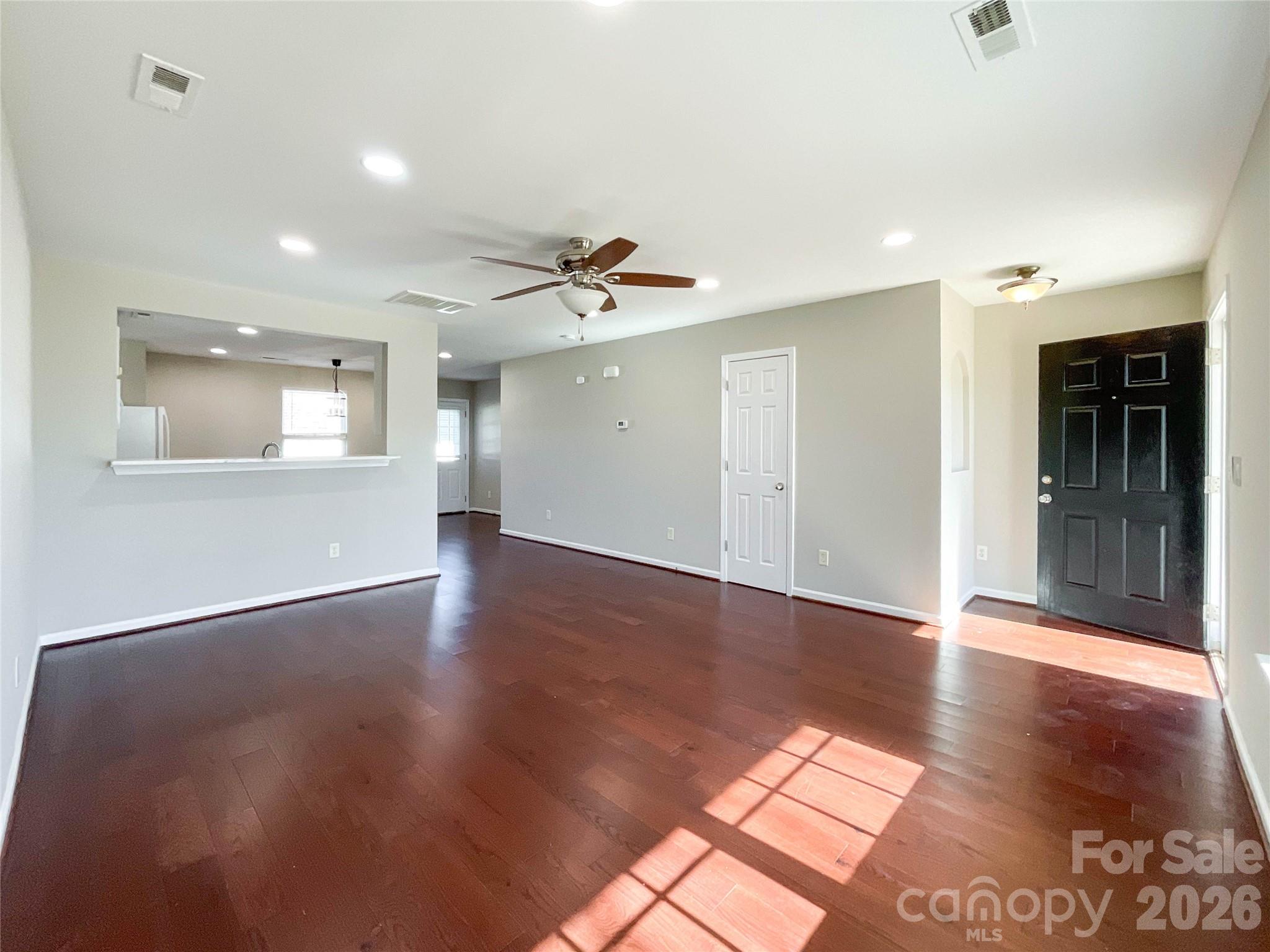 301 Foster Lane Albemarle, NC 28001 - Photo 12 of 41 a view of an empty room with window and wooden floor