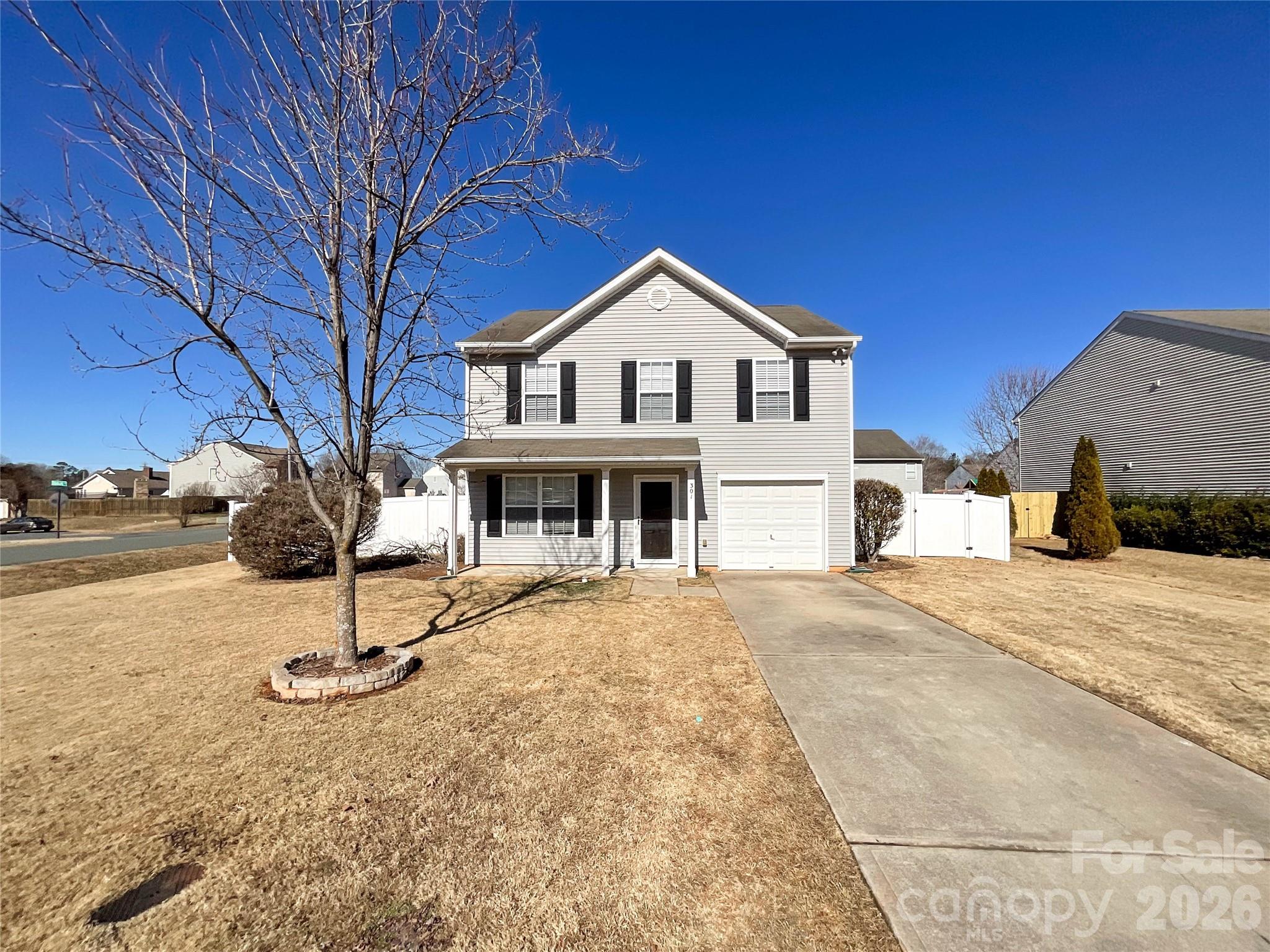 301 Foster Lane Albemarle, NC 28001 - Photo 2 of 41 a front view of a house with a yard