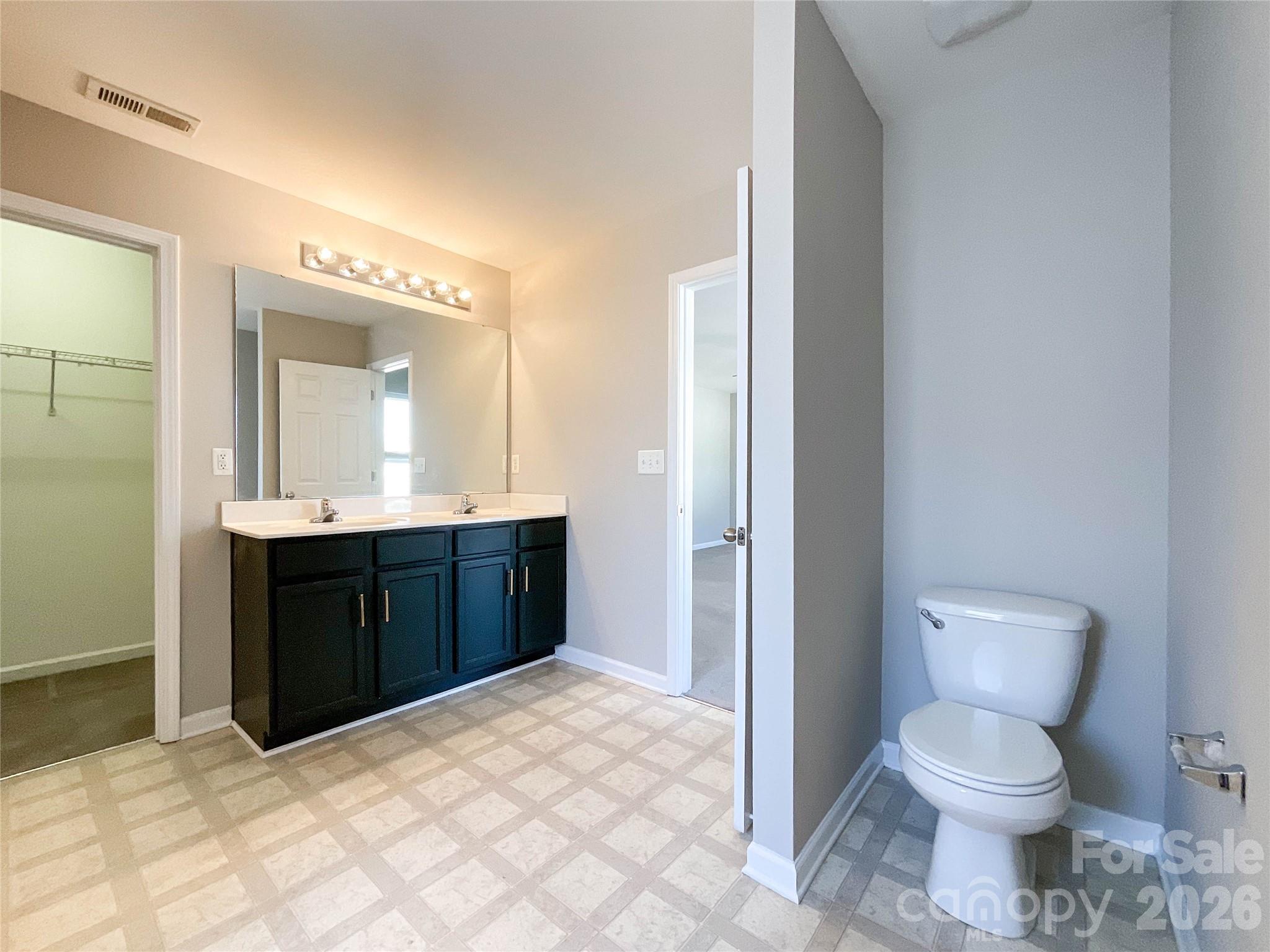 301 Foster Lane Albemarle, NC 28001 - Photo 26 of 41 a bathroom with a granite countertop sink toilet and shower