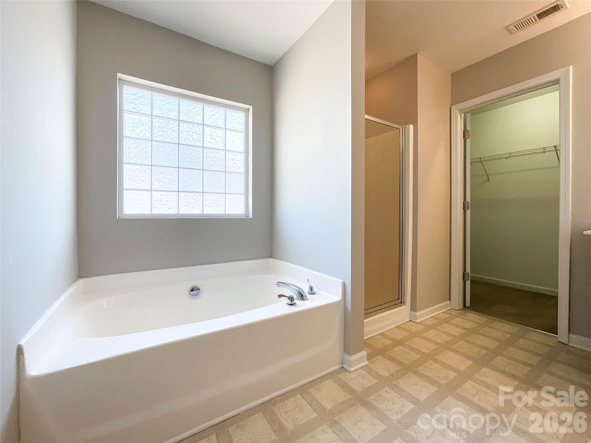 301 Foster Lane Albemarle, NC 28001 - Photo 27 of 41 a bathroom with a bathtub and shower