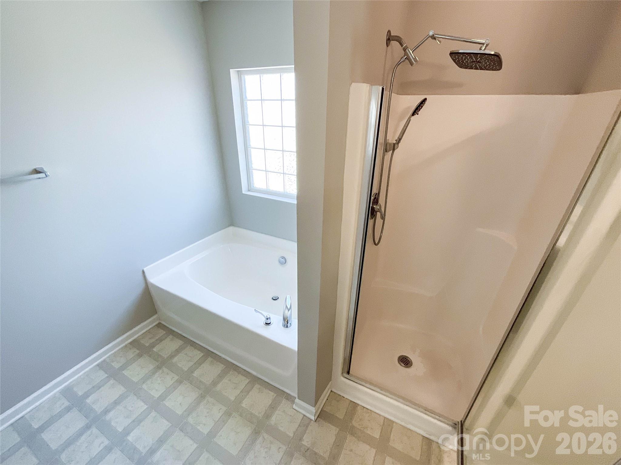 301 Foster Lane Albemarle, NC 28001 - Photo 28 of 41 a bathroom with a tub and shower