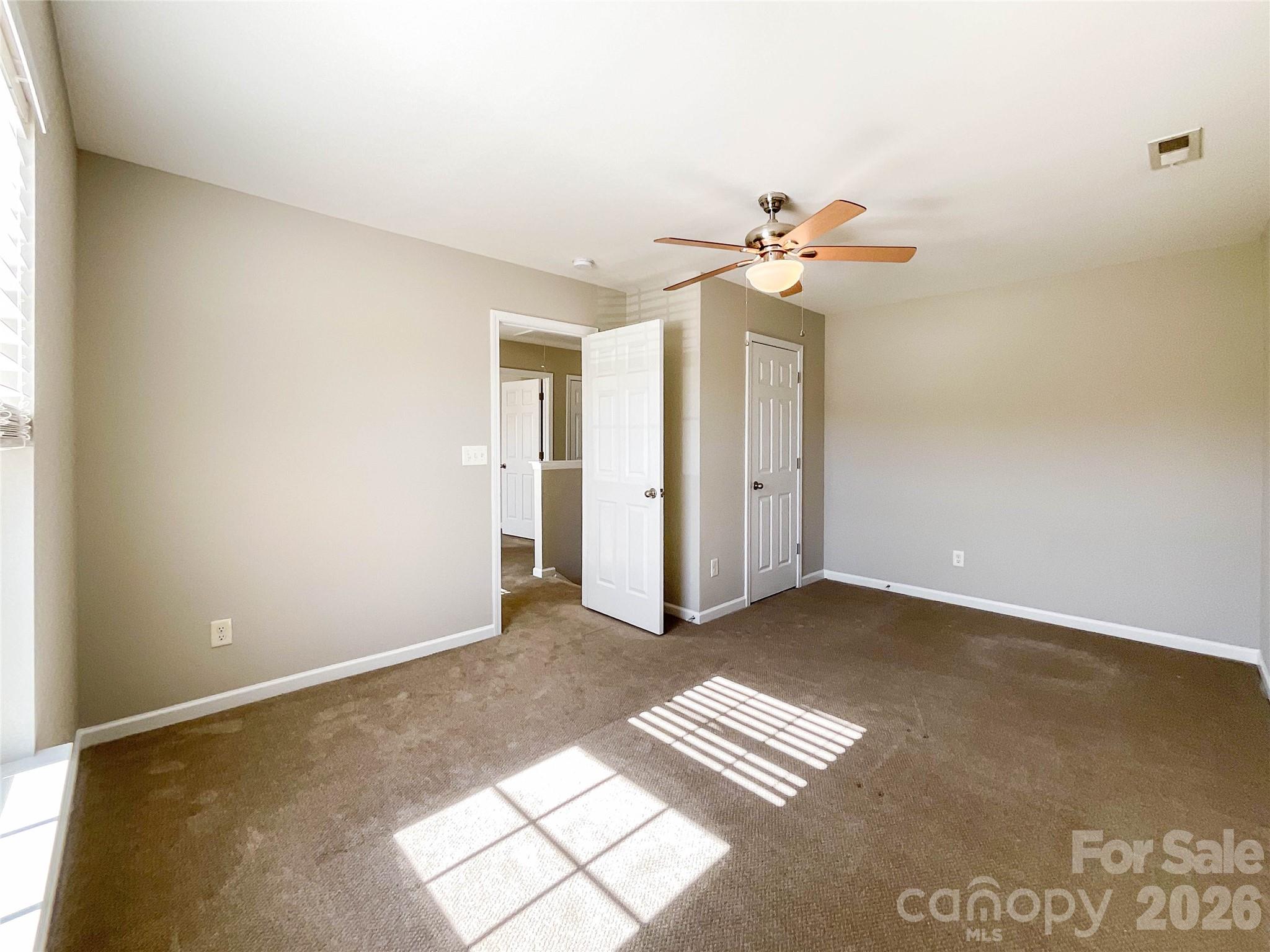 301 Foster Lane Albemarle, NC 28001 - Photo 30 of 41 an empty room with windows and fan