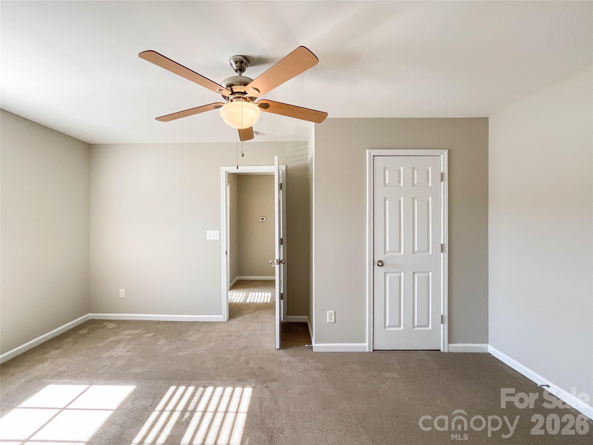 301 Foster Lane Albemarle, NC 28001 - Photo 31 of 41 an empty room with windows and fan