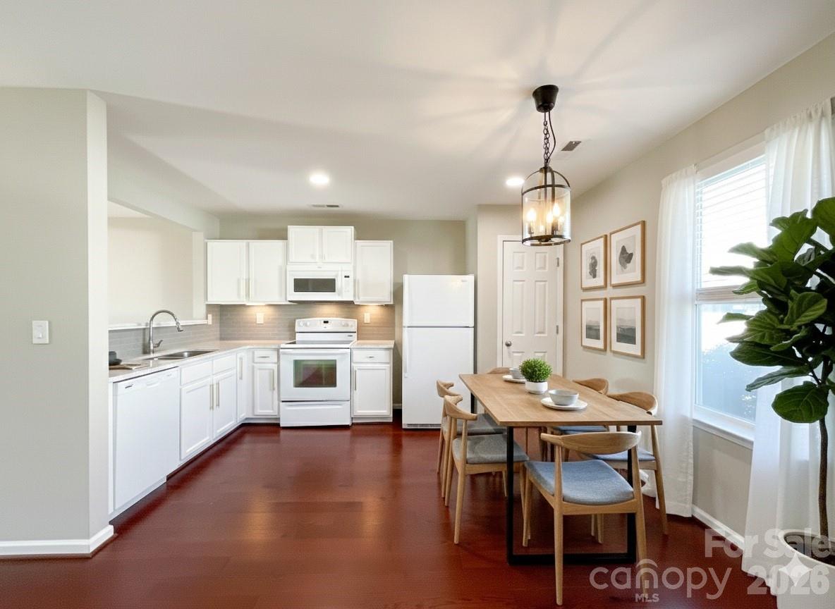 301 Foster Lane Albemarle, NC 28001 - Photo 5 of 41 a open kitchen with granite countertop white cabinets and stainless steel appliances