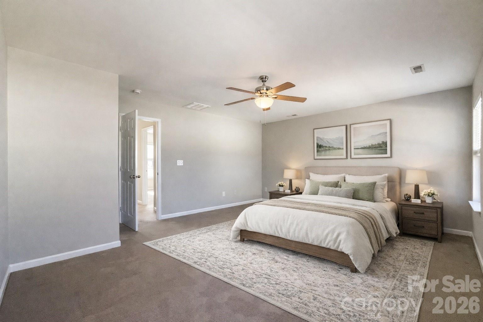 301 Foster Lane Albemarle, NC 28001 - Photo 6 of 41 a bedroom with a large bed and a chandelier