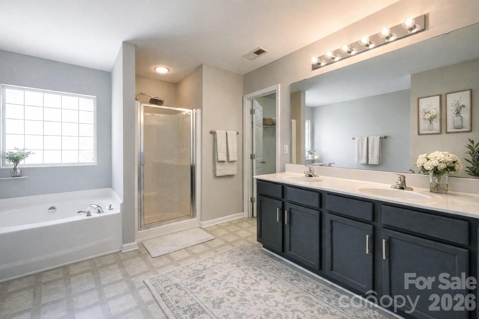 301 Foster Lane Albemarle, NC 28001 - Photo 7 of 41 a spacious bathroom with a tub sink shower and mirror