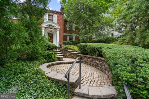 a view of backyard with swimming pool and outdoor seating