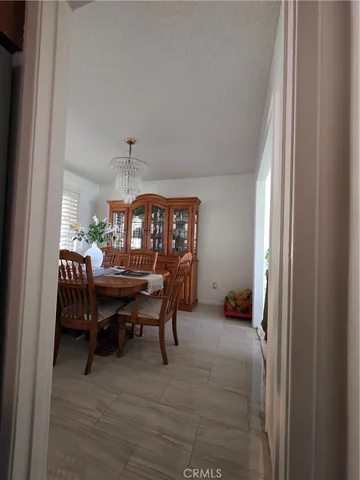 a view of a backyard with table and chairs