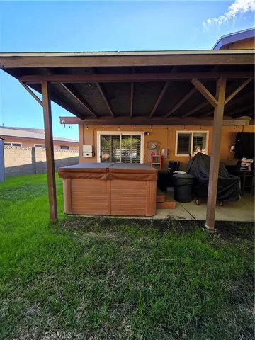 a kitchen with refrigerator and cabinets