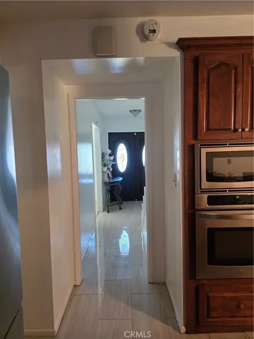 a kitchen with stainless steel appliances granite countertop a stove and cabinets