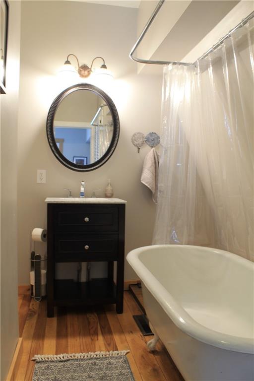 401 Bear Rocks Road Acme, PA 15610 - Photo 16 of 25 a bathroom with a sink a toilet and a mirror