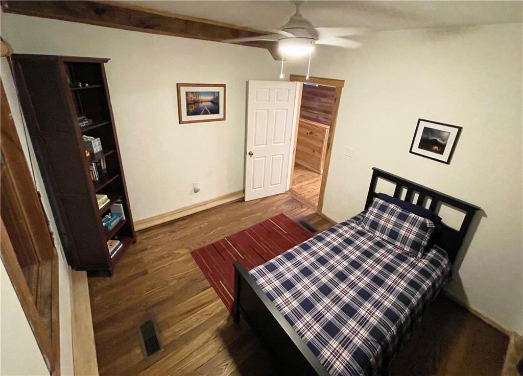 401 Bear Rocks Road Acme, PA 15610 - Photo 17 of 25 a view of an empty room with wooden floor and stairs