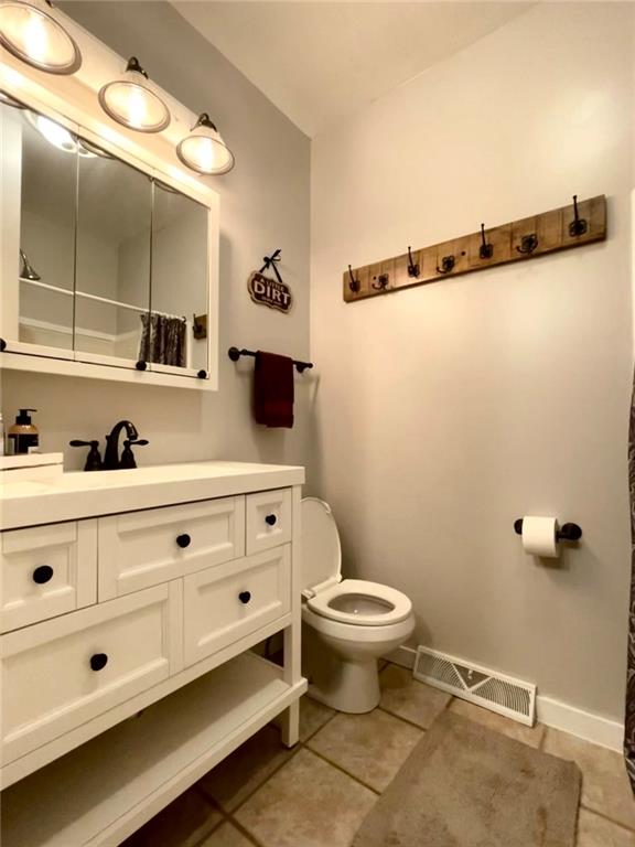 401 Bear Rocks Road Acme, PA 15610 - Photo 19 of 25 a bathroom with a sink and a mirror