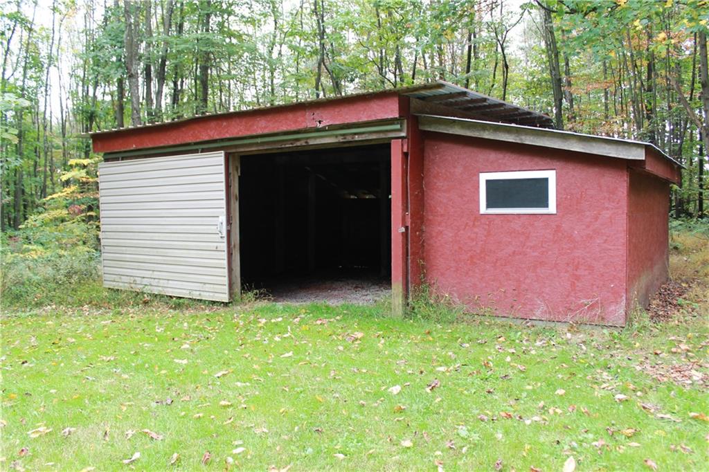401 Bear Rocks Road Acme, PA 15610 - Photo 22 of 25 a view of front of a house with a yard