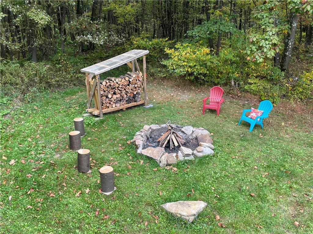 401 Bear Rocks Road Acme, PA 15610 - Photo 24 of 25 a view of a table and chairs in the back yard