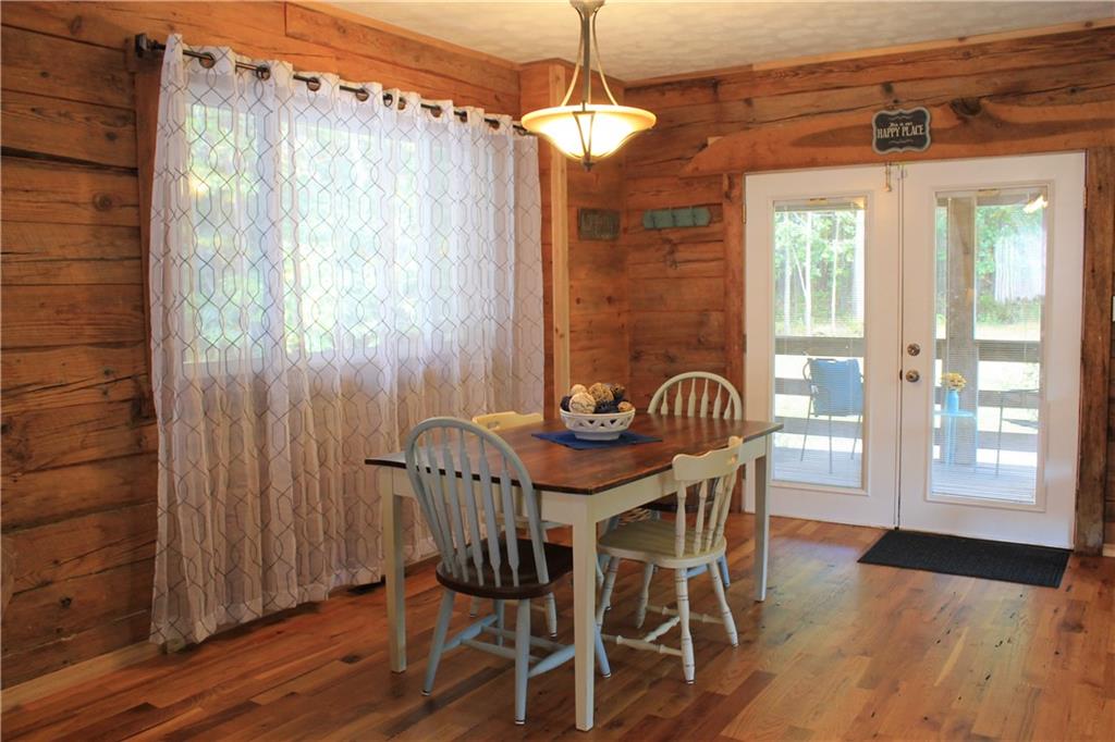 401 Bear Rocks Road Acme, PA 15610 - Photo 6 of 25 a view of a dining room with furniture wooden floor and chandelier