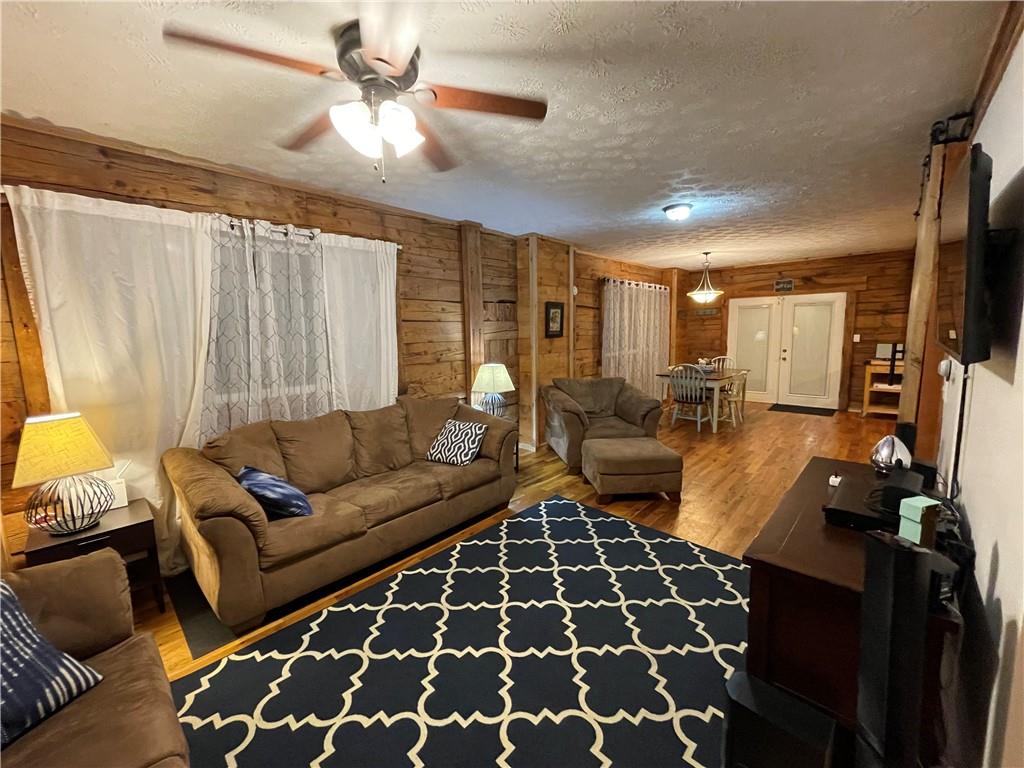 401 Bear Rocks Road Acme, PA 15610 - Photo 8 of 25 a living room with furniture and a rug
