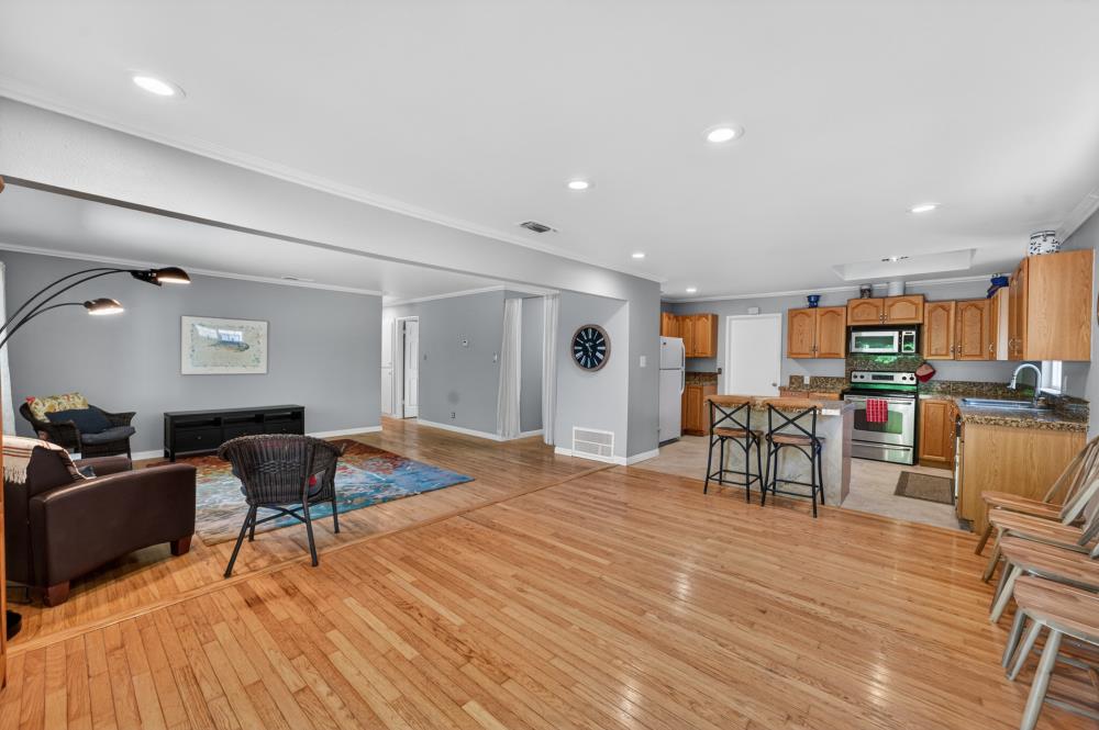 10653 Campana Way Rancho Cordova, CA 95670 - Photo 15 of 49 a living room with furniture and kitchen view