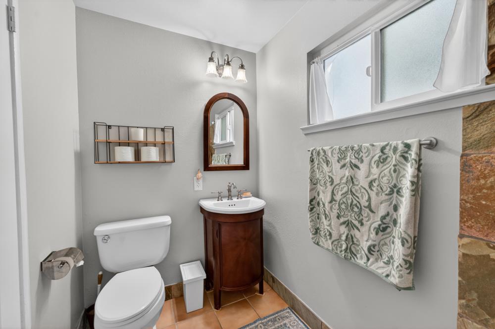 10653 Campana Way Rancho Cordova, CA 95670 - Photo 29 of 49 a bathroom with a toilet sink and mirror