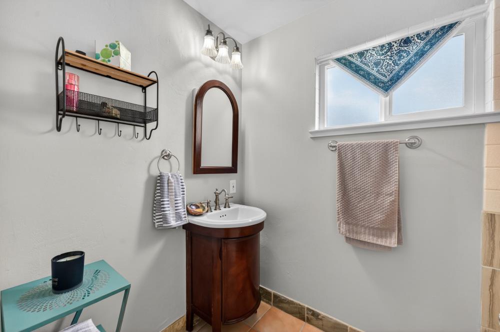 10653 Campana Way Rancho Cordova, CA 95670 - Photo 34 of 49 a bathroom with a sink and a mirror