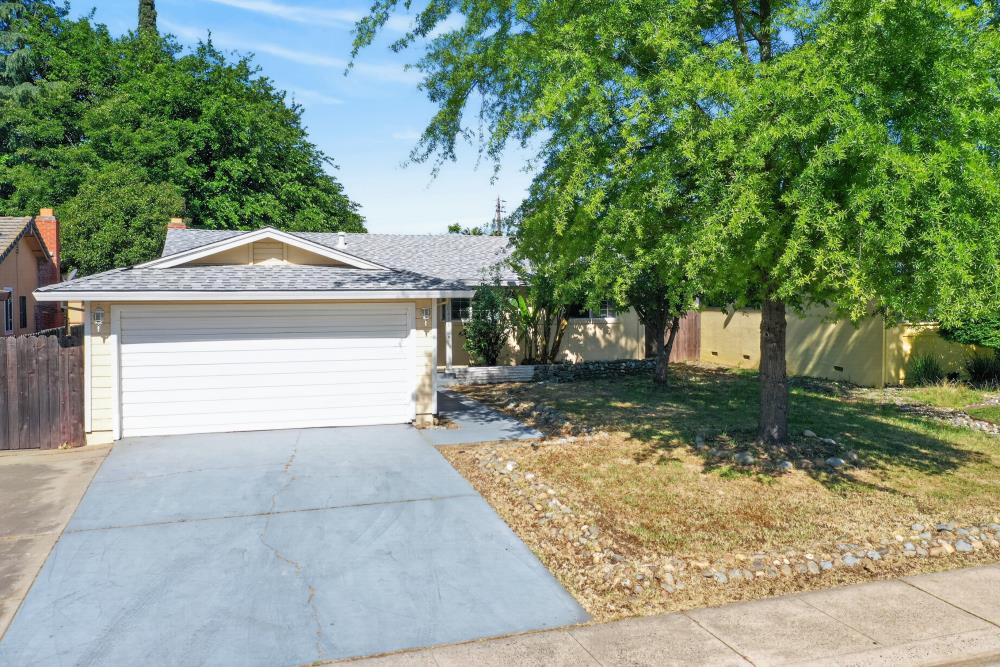10653 Campana Way Rancho Cordova, CA 95670 - Photo 46 of 49 a front view of a house with a yard and garage