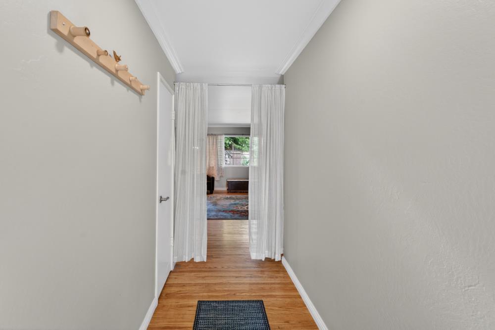 10653 Campana Way Rancho Cordova, CA 95670 - Photo 5 of 49 a view of a hallway with wooden floor and a bathroom