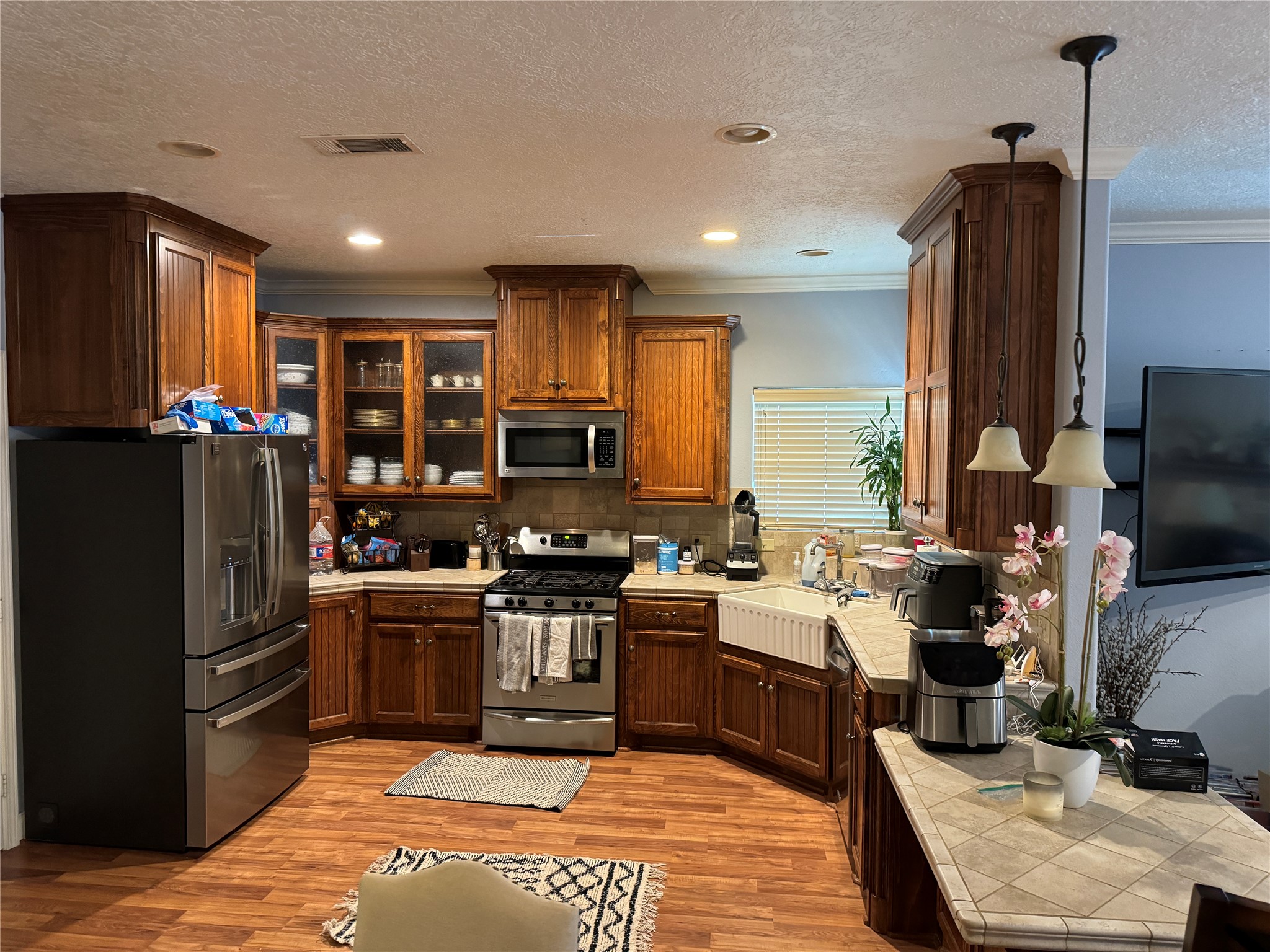 10702 Crosby Lynchburg Road Highlands, TX 77562 - Photo 16 of 18 a kitchen with stainless steel appliances granite countertop a stove refrigerator and a sink