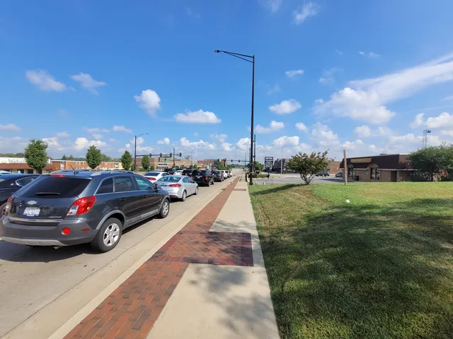 a view of street with parked cars