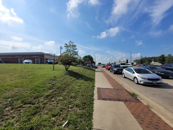 a view of yard with cars parked