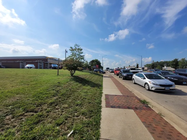 a view of yard with cars parked