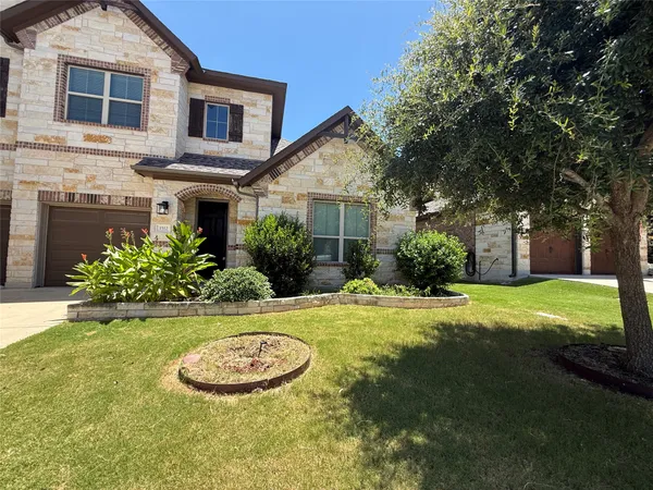a view of a house with pool and garden