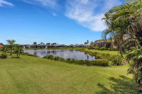 a kitchen with stainless steel appliances kitchen island granite countertop a sink and cabinets