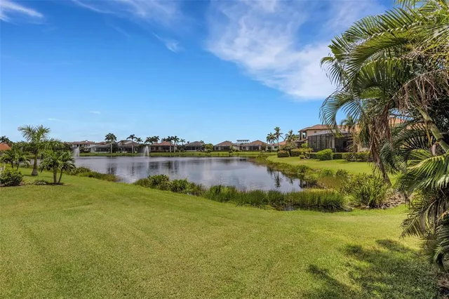a kitchen with stainless steel appliances kitchen island granite countertop a sink and cabinets