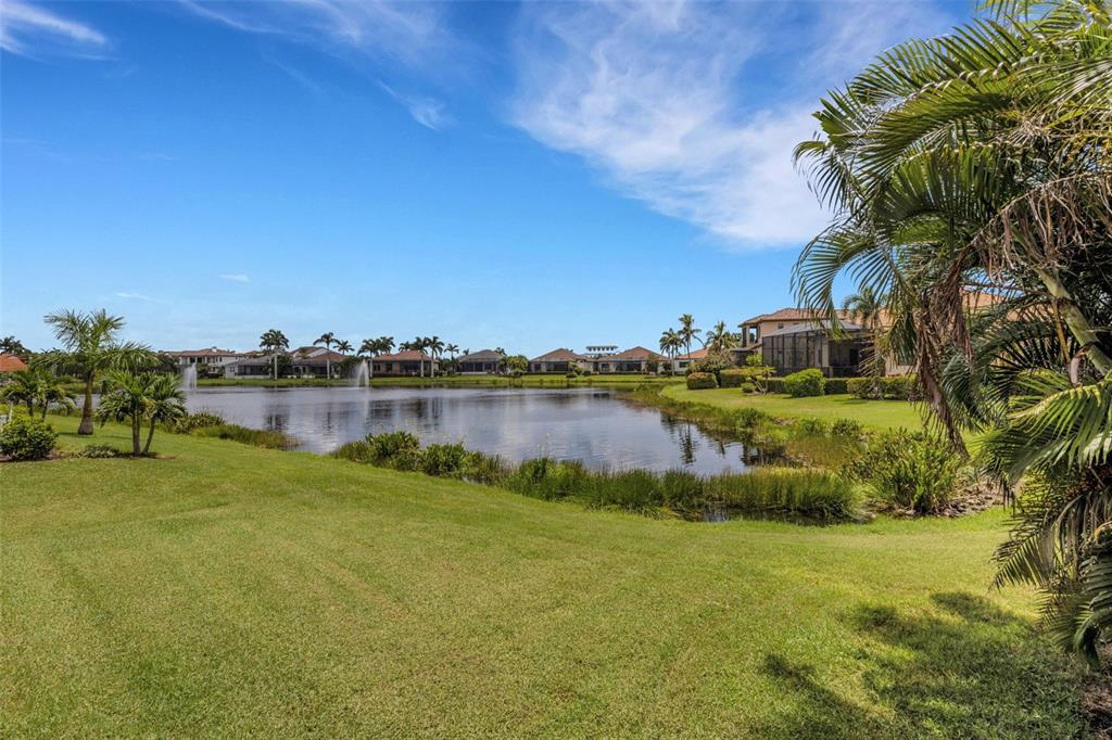 5718 Title Row Drive Bradenton, FL 34210 - Photo 13 of 74 a view of a lake with houses in the background