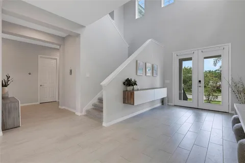 a bedroom with a bed and a chair in it