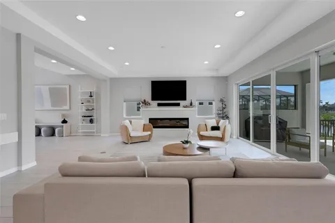a living room with furniture flowerpot and a rug