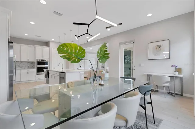 a bathroom with a sink a toilet a large mirror and shower