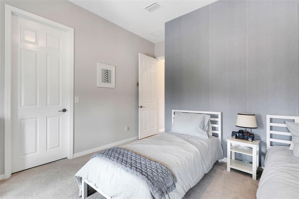 5718 Title Row Drive Bradenton, FL 34210 - Photo 57 of 74 a bedroom with a bed and lamp