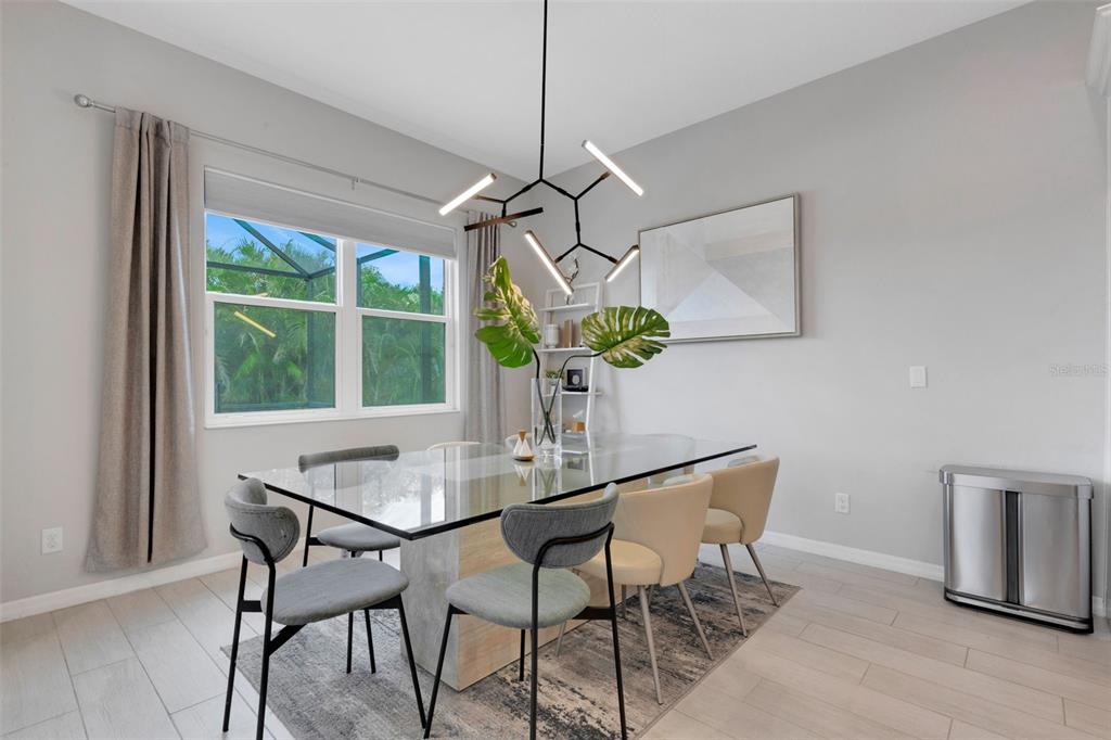 5718 Title Row Drive Bradenton, FL 34210 - Photo 6 of 74 a dining room with furniture and window