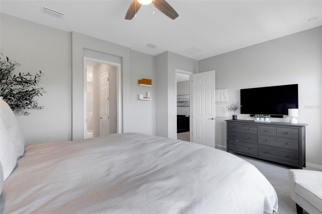 5718 Title Row Drive Bradenton, FL 34210 - Photo 64 of 74 a bedroom with a bed and a flat screen tv