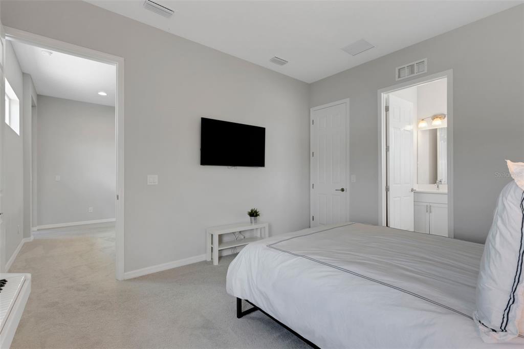 5718 Title Row Drive Bradenton, FL 34210 - Photo 71 of 74 a bedroom with a bed and a flat screen tv