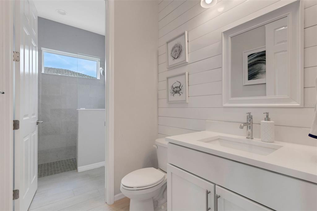 5718 Title Row Drive Bradenton, FL 34210 - Photo 73 of 74 a bathroom with a sink toilet and shower