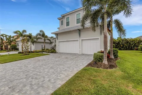 a view of a lake with houses in the background