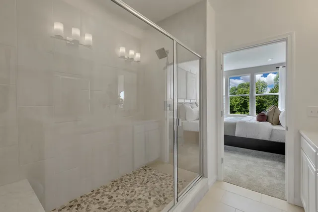a bathroom with a shower and a sink