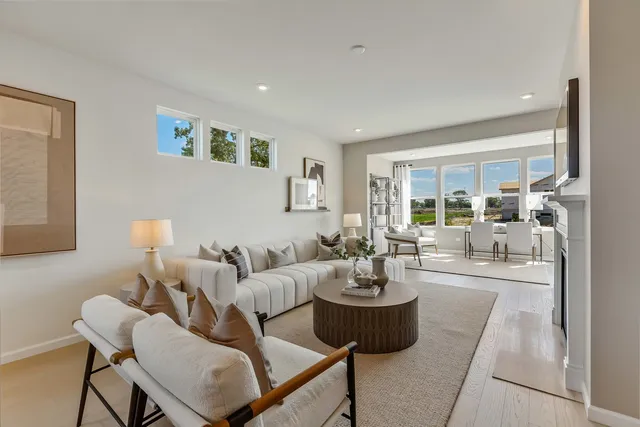 a living room with furniture and a table
