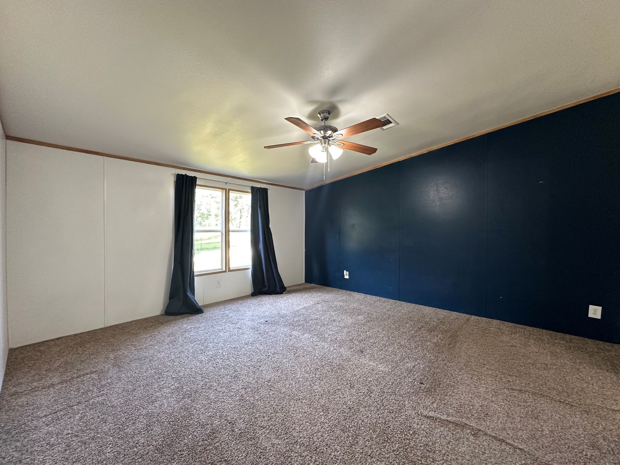 29 Brumley Street Huntsville, TX 77320 - Photo 11 of 17 a view of an empty room with a window