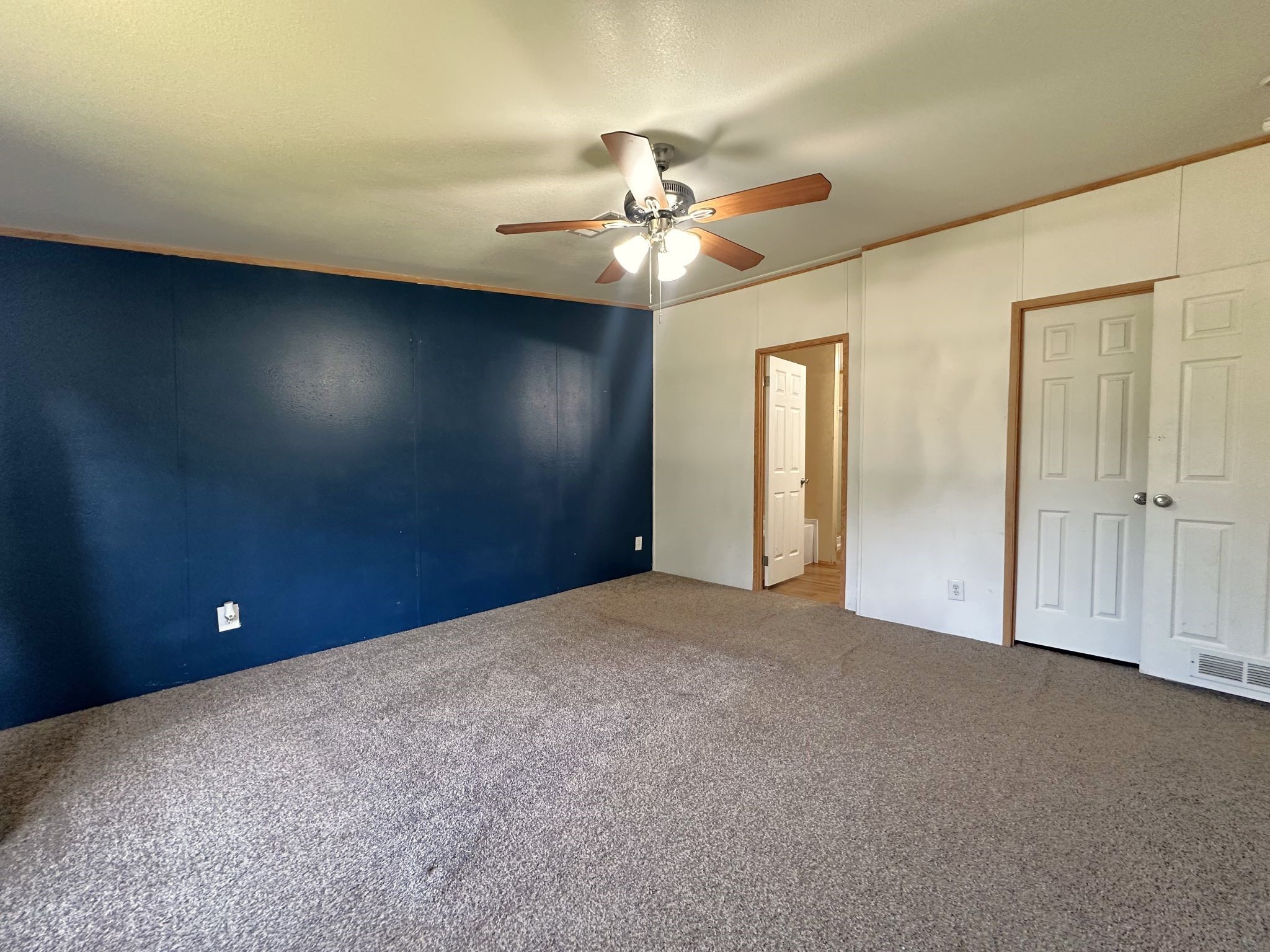 29 Brumley Street Huntsville, TX 77320 - Photo 12 of 17 a view of an empty room and chandelier fan