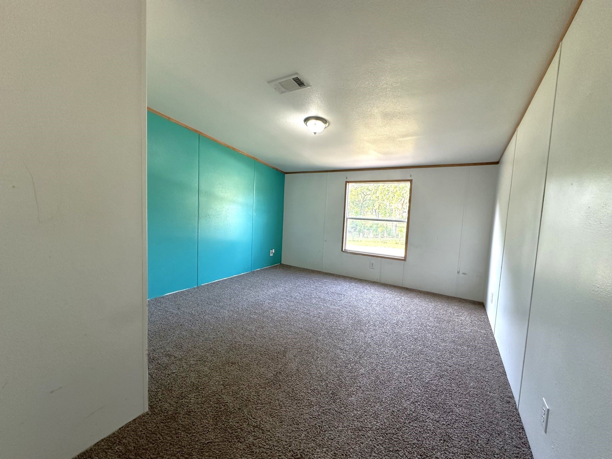 29 Brumley Street Huntsville, TX 77320 - Photo 15 of 17 a view of an empty room and window
