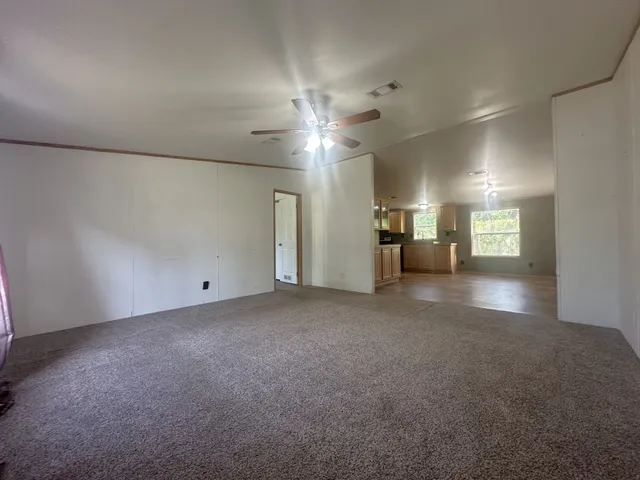 a view of a livingroom and mountain view