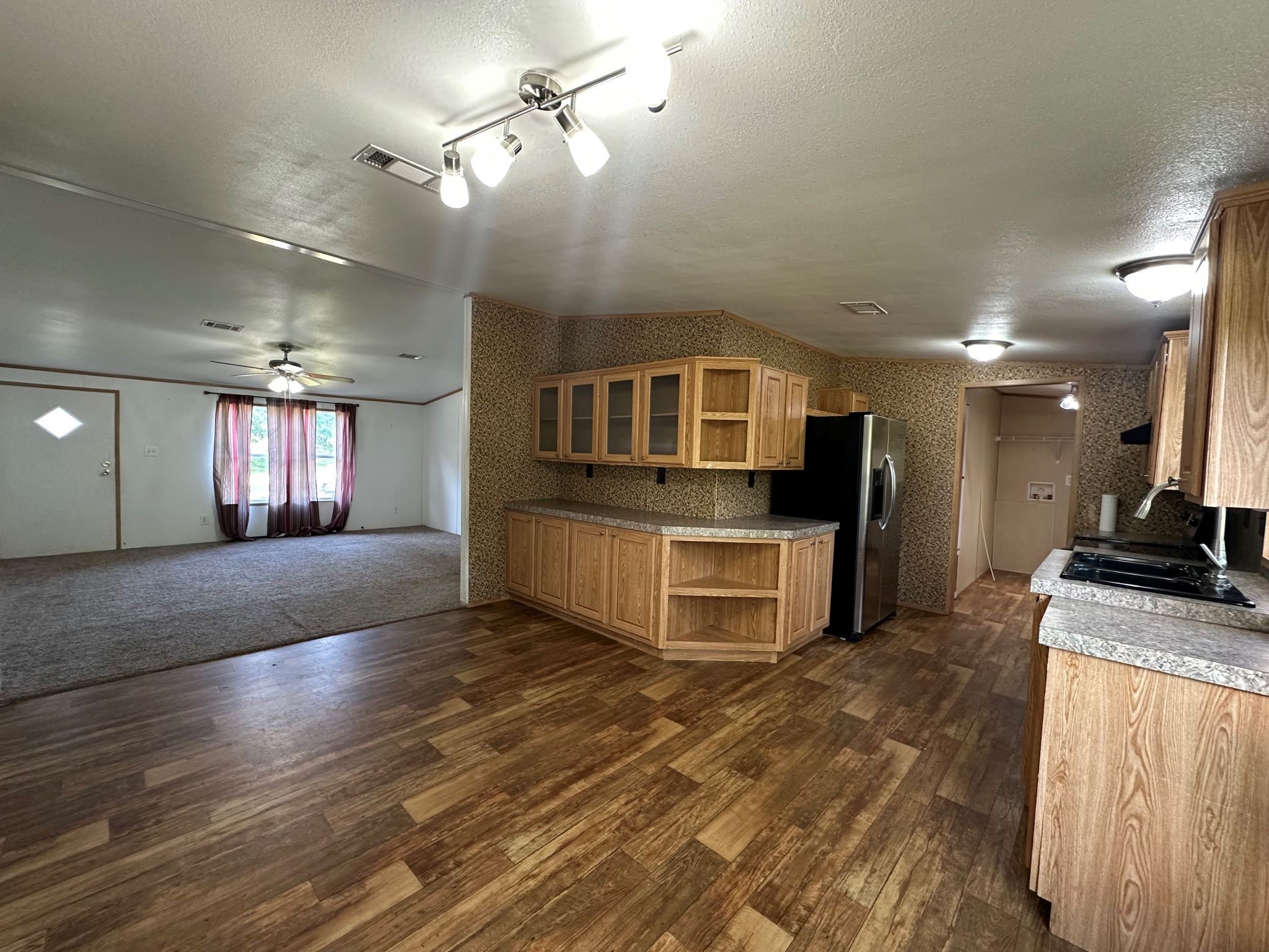 29 Brumley Street Huntsville, TX 77320 - Photo 9 of 17 a view of a kitchen with a sink and a stove top oven